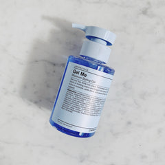 J Beverly Hills Blue Gel Me being used on damp hair for sculpted looks.
