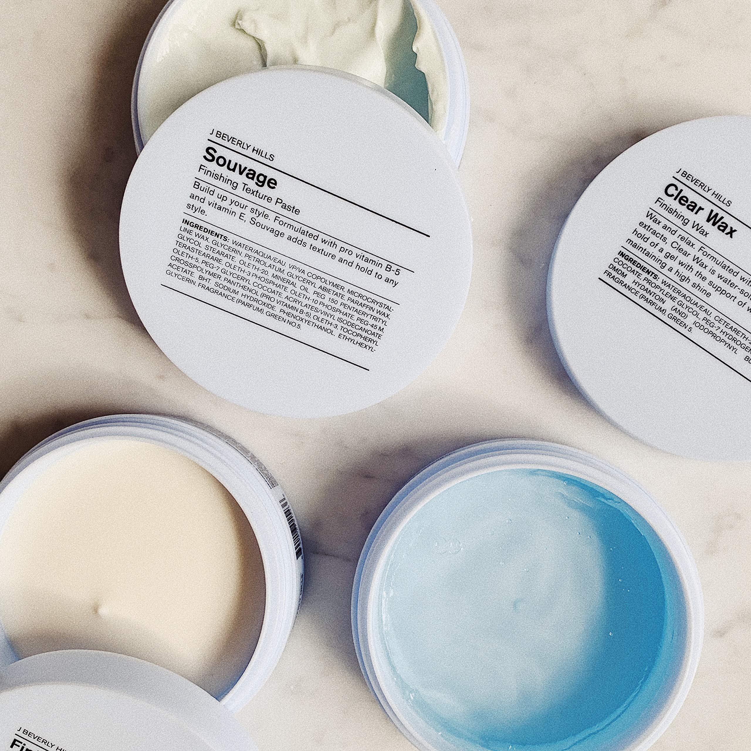 J Beverly Hills Blue Souvage Paste in hands for shaping texture.