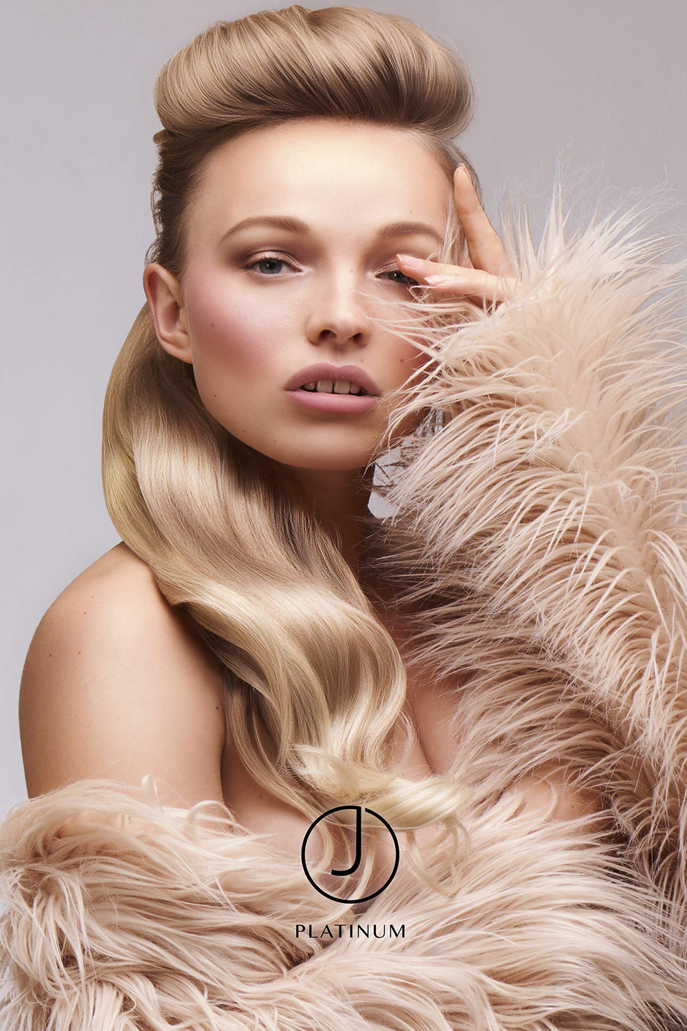 J Beverly Hills Platinum Volume Conditioner in use, ready to tame frizz and add body.