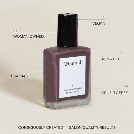 J. Hannah nail polish bottle with brush for precise, even application.