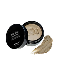Jack Henry Premium Hair Clay bottle ready for all-day matte styling.