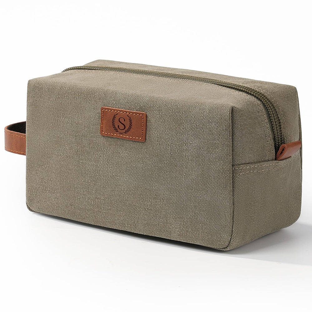 Janhavi olive green canvas dopp kit showing rugged travel durability and organized storage