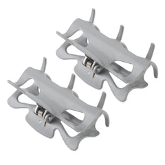 Jauarta clip close-up showing stainless steel springs for durable sectioning