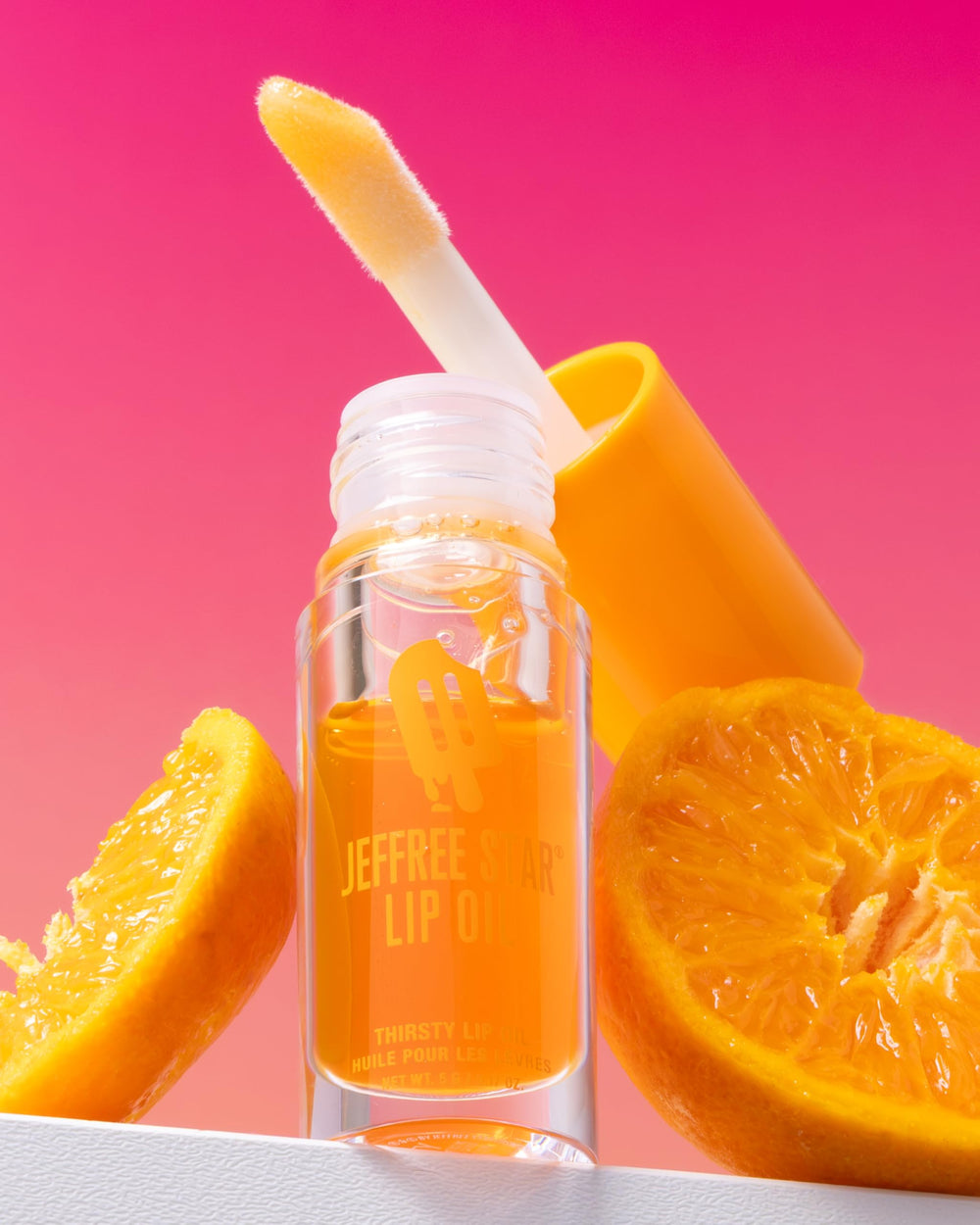 Jeffree Star Lip Oil Wyoming Winter bottle adds cool-toned shine and moisture.
