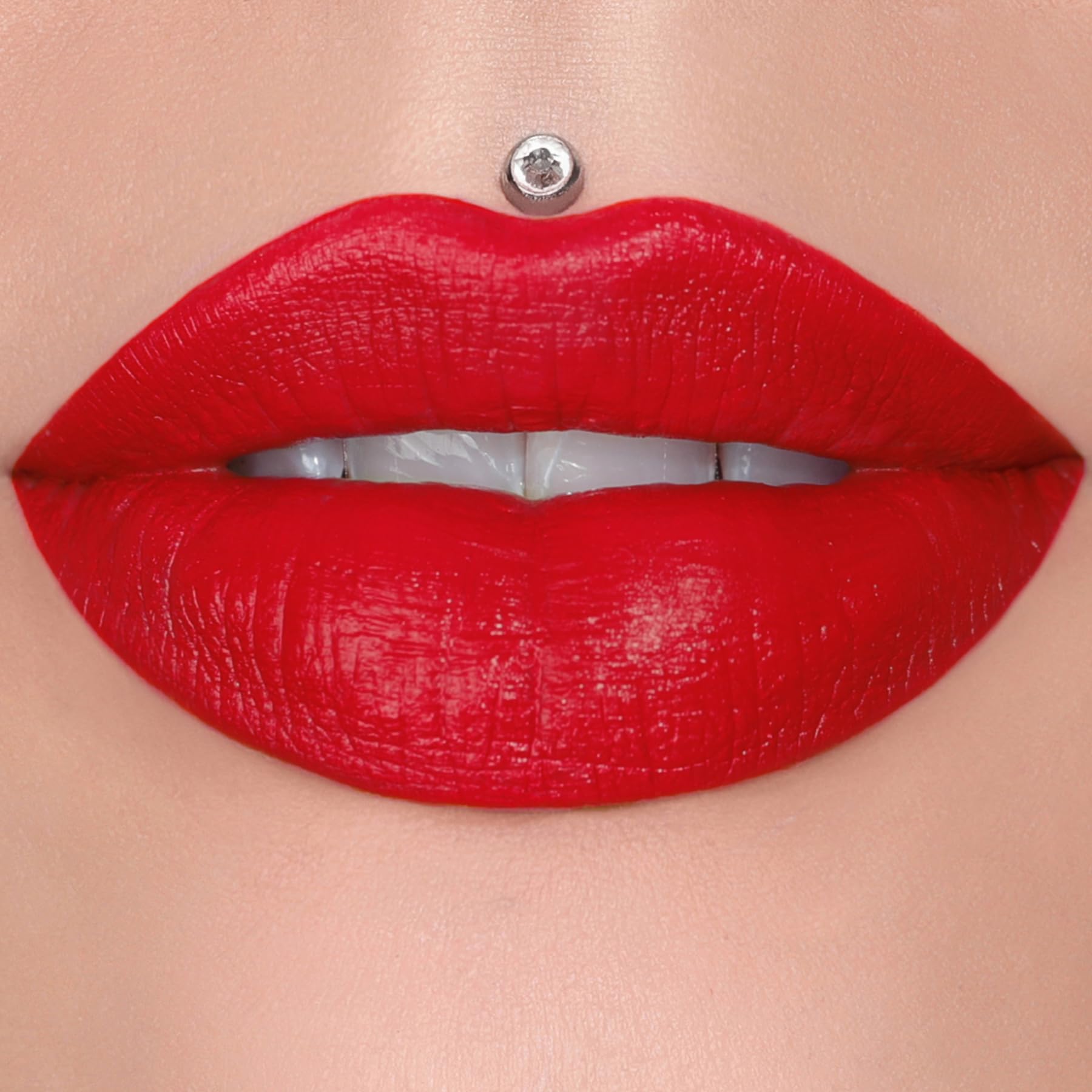 Jeffree Star Velvet Trap Red Affair swatch on skin, bold red pigment