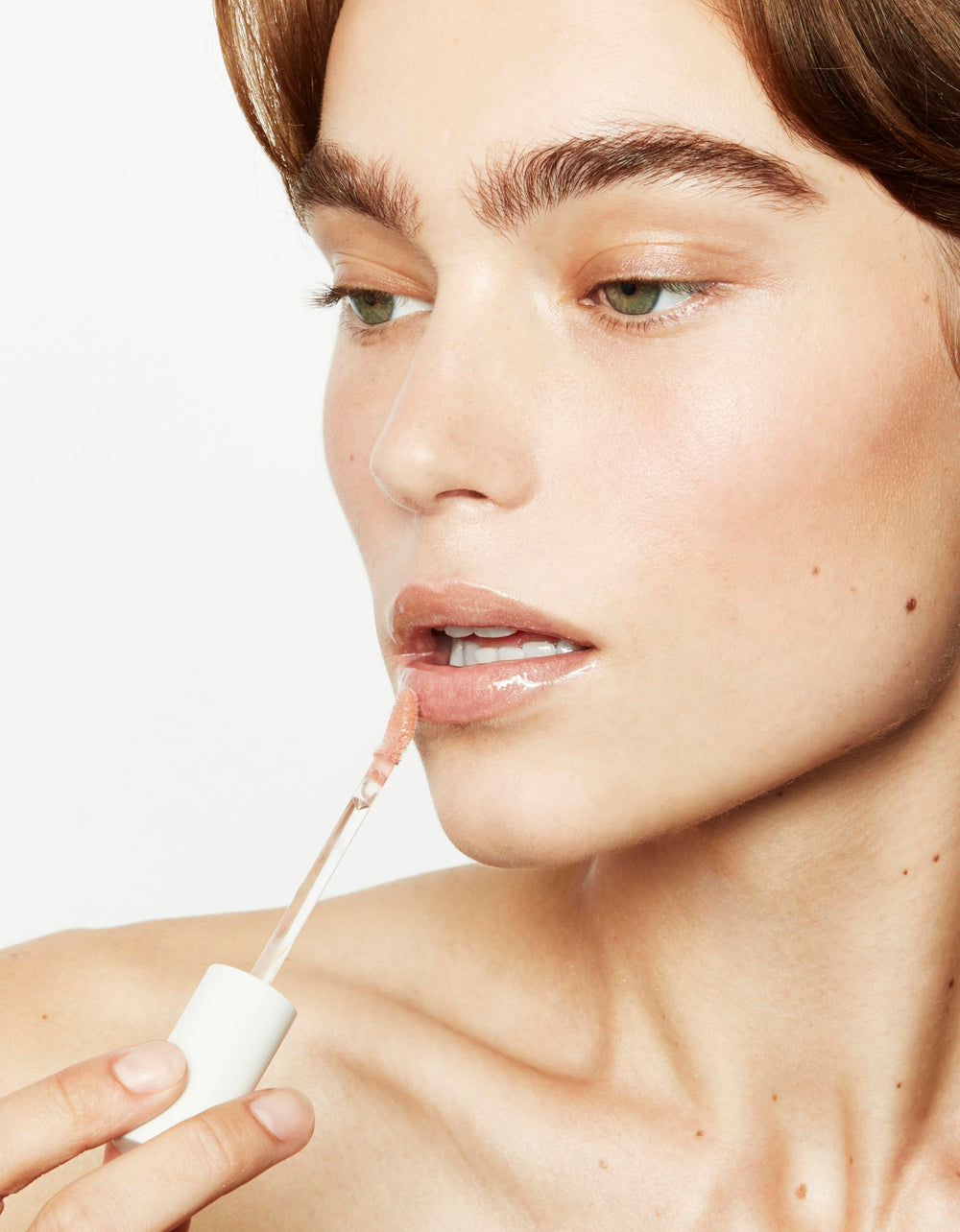 Jillian Dempsey Lip Gloss Bubble Pink shade may visually brighten teeth
