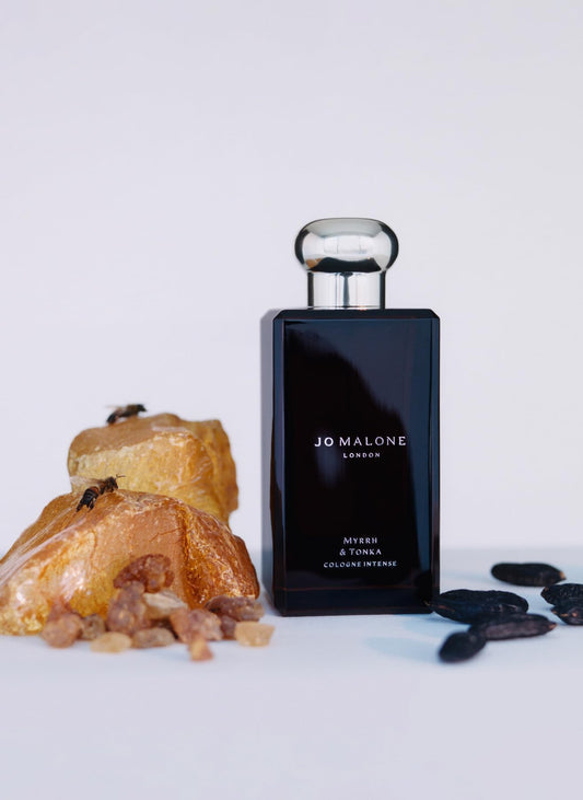 Jo Malone Myrrh & Tonka bottle closeup reveals resin warmth and tonka notes for introspection.