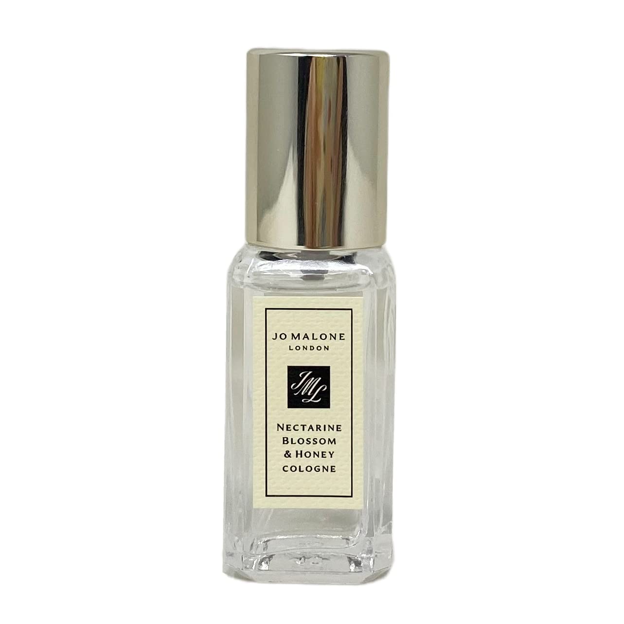 Jo Malone Nectarine Blossom & Honey travel-size bottle, showcasing fruity-floral scent for day wear.