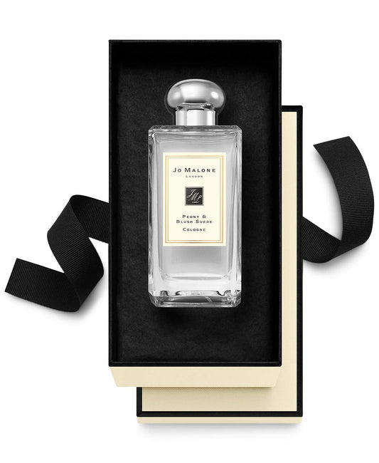 Jo Malone Peony & Blush Suede application close-up, showcasing luxurious scent layering possibilities