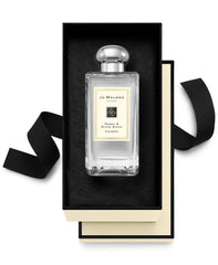 Jo Malone Peony & Blush Suede application close-up, showcasing luxurious scent layering possibilities