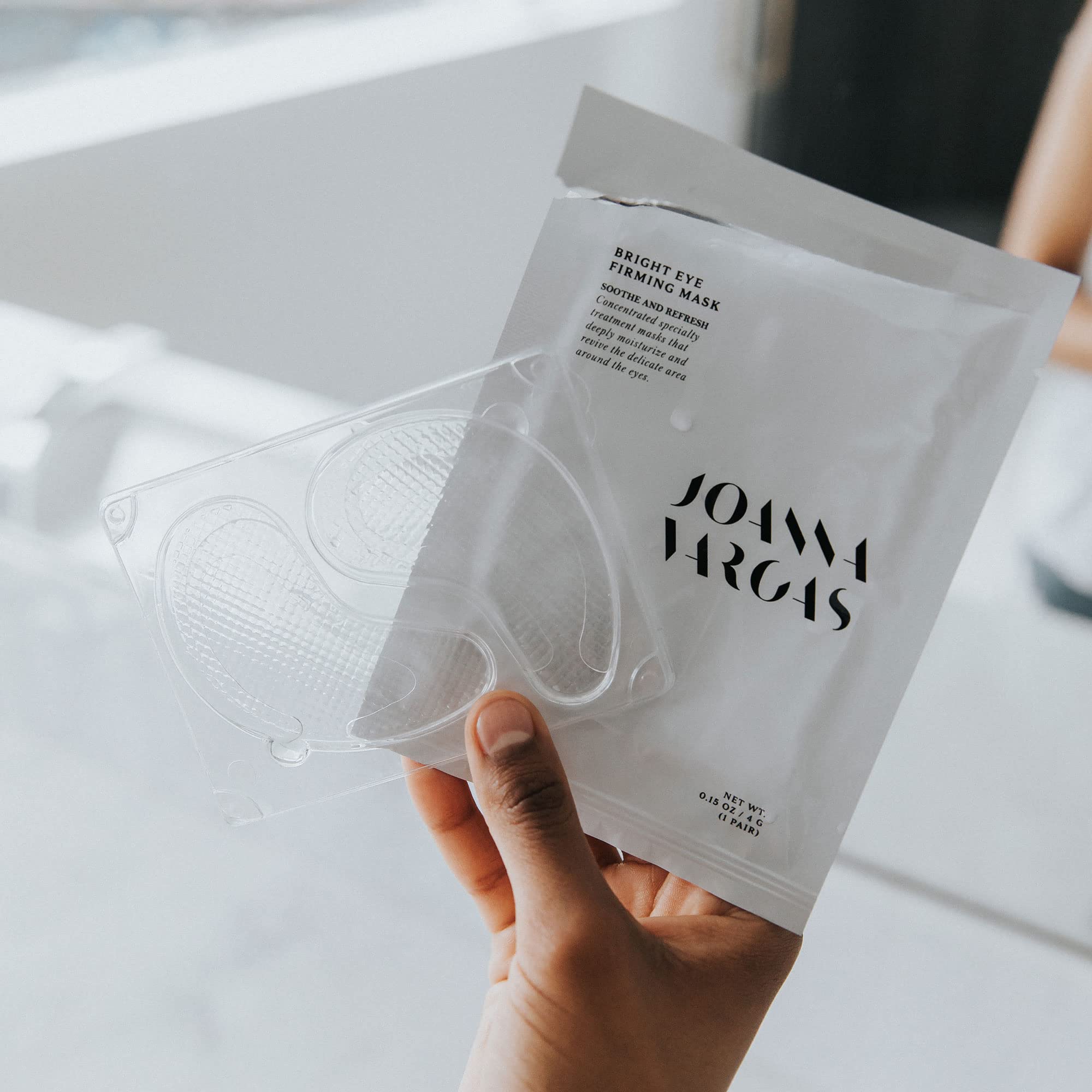 Joanna Vargas tray removal and patch placement for quick travel skincare.