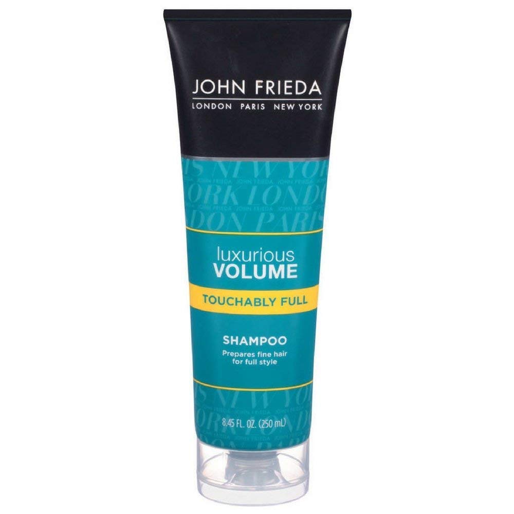 John Frieda Luxurious Volume shampoo bottle for lift and body on fine hair.