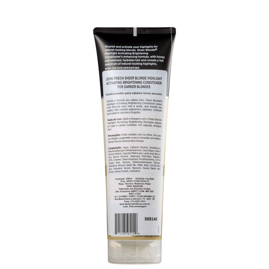 John Frieda Sheer Blonde Brightening Conditioner applied to hair for vibrant tones.