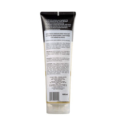 John Frieda Sheer Blonde Brightening Conditioner applied to hair for vibrant tones.