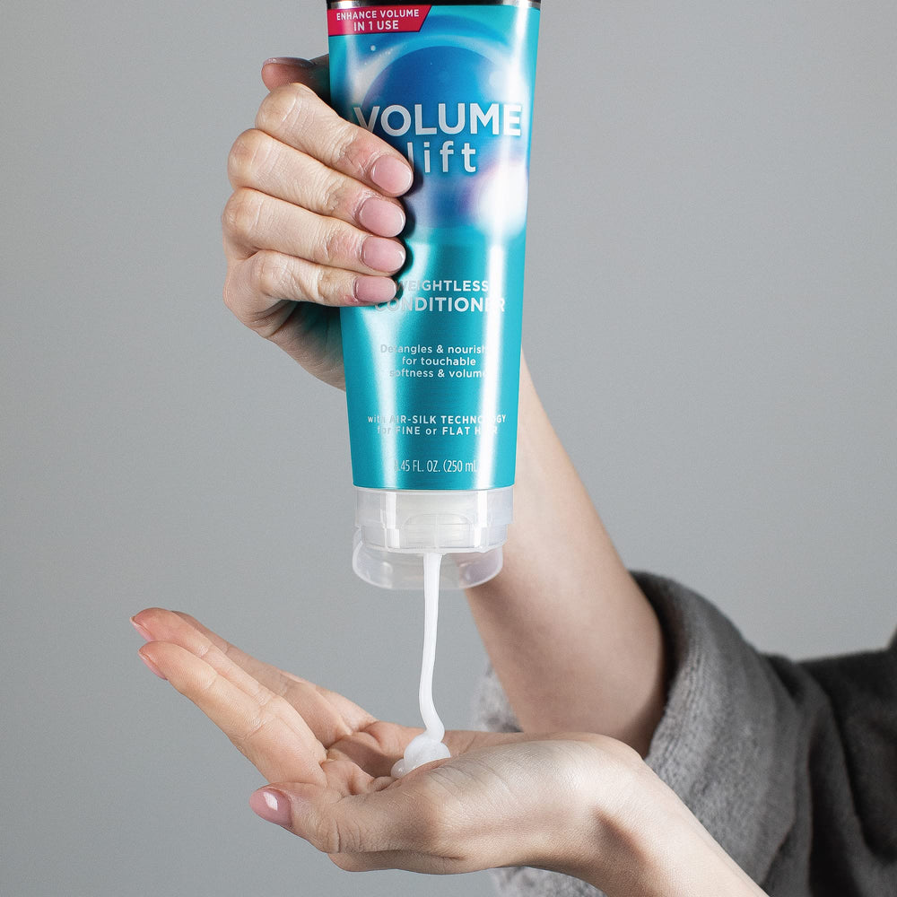 John Frieda Volume Lift conditioner on a sink shelf demonstrates accessible routine.