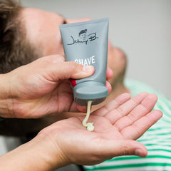 Johnny B shave cream tube application demonstrates massage and rinse steps.