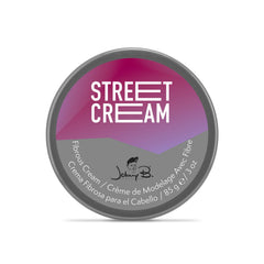 Johnny B. Street Cream being used to add lift and volume to the crown.