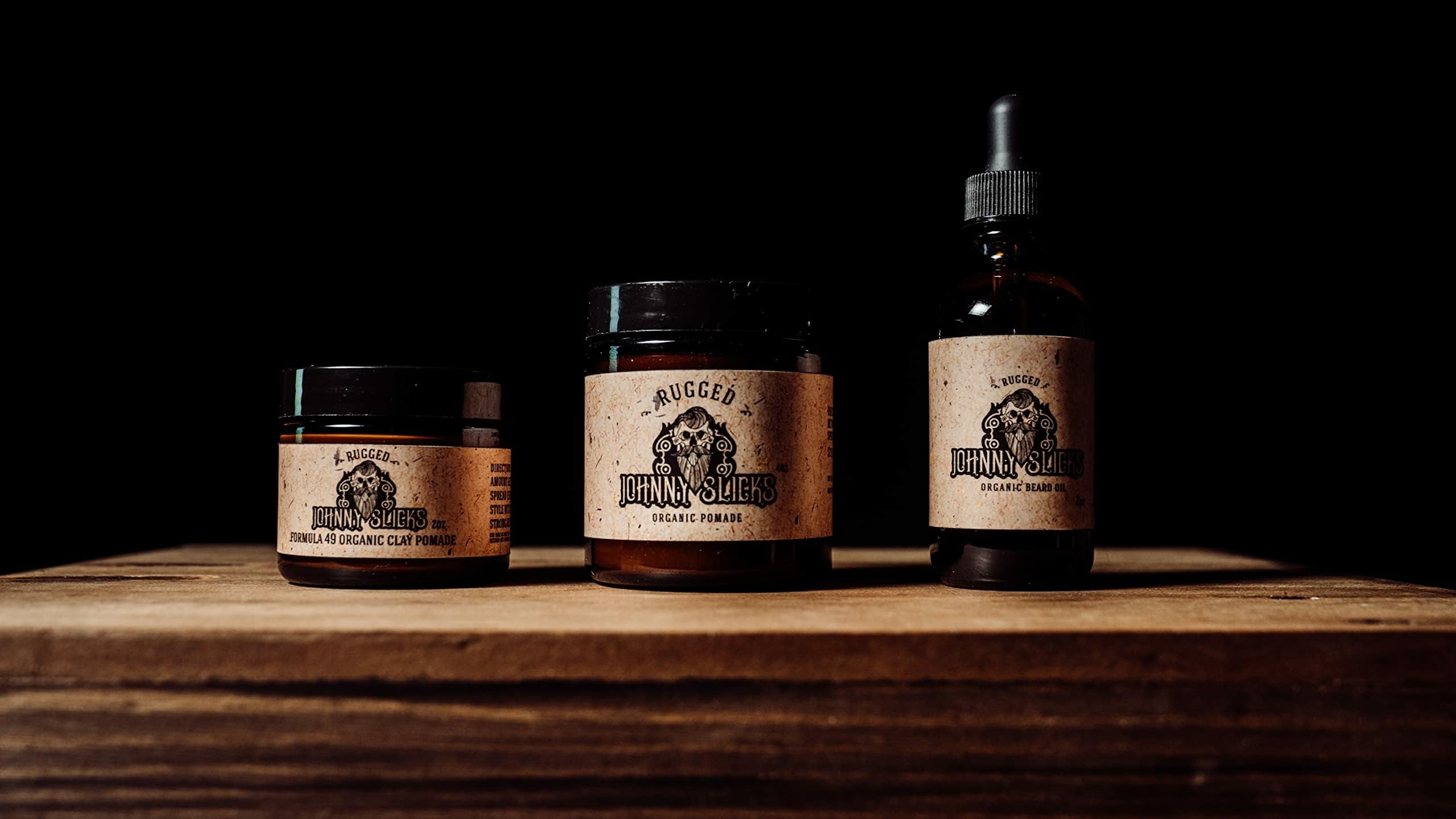 Johnny Slicks Formula 49 clay beeswax texture close-up emphasizes natural ingredients and hydration.