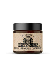 Johnny Slicks Formula 49 clay bottle pour demonstrates controlled application for firm styling.