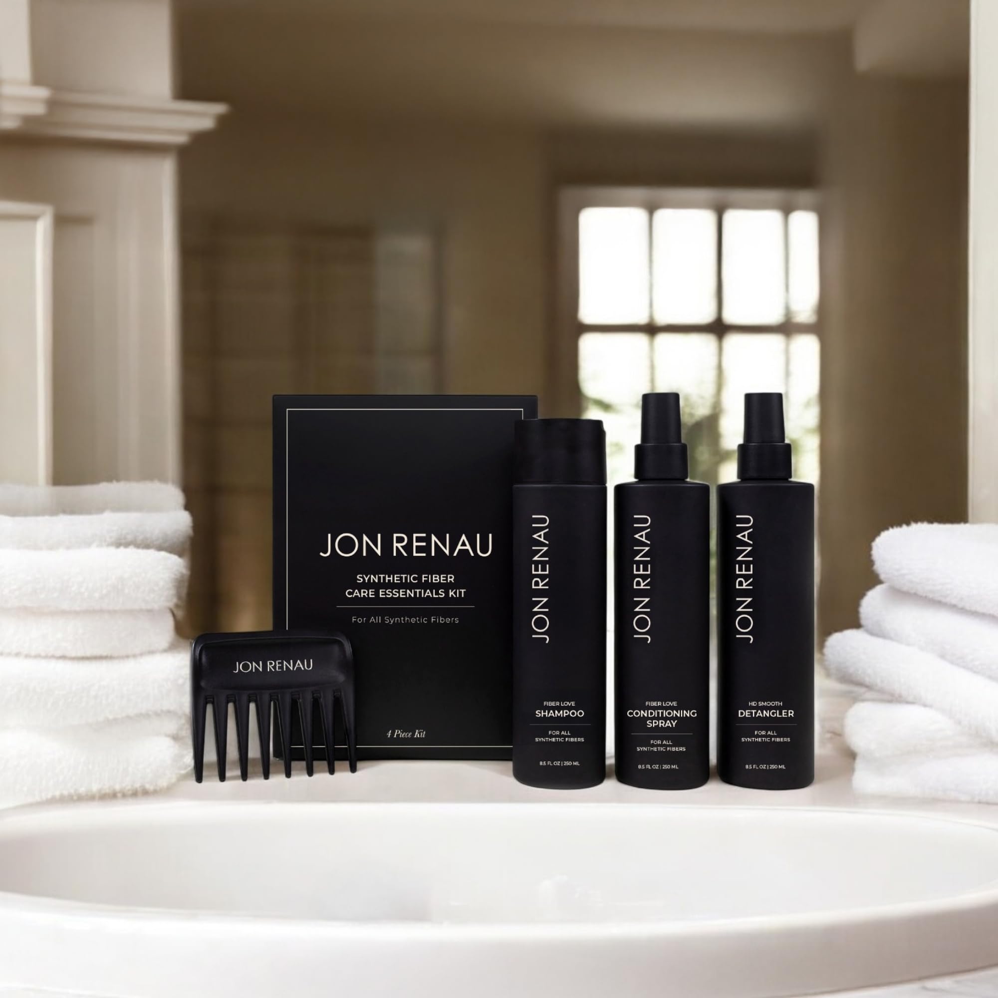Jon Renau wide-tooth comb for gentle detangling and even product distribution.