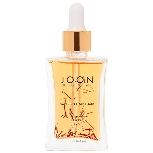 Joon Saffron Hair Elixir bottle pour demonstrates quick absorption for frizz control.