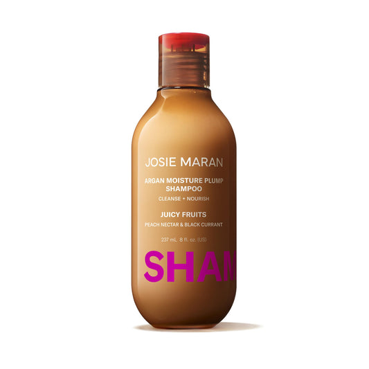 Josie Maran Argan Moisture Plump Shampoo bottle-front view highlights hydration and shine.