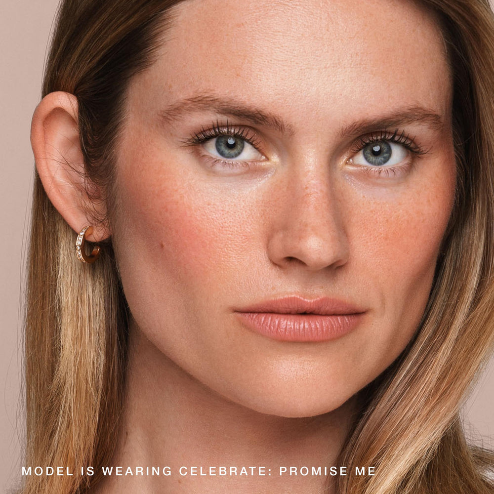 Jouer Blush & Bloom makeup bag display suggests on-the-go use.