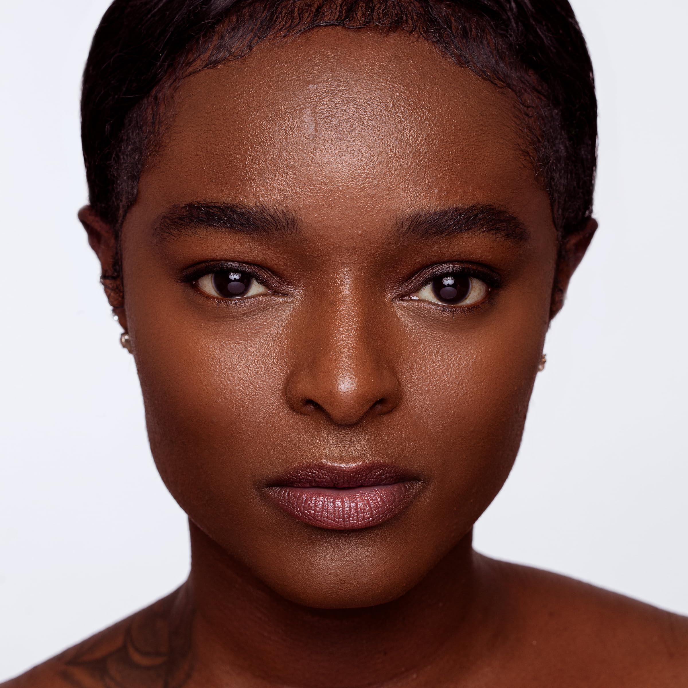 Jouer Essential Brightening Concealer under-eye application demonstrating even, lifted skin