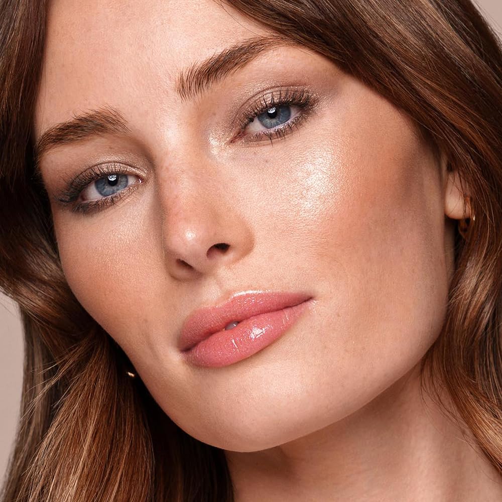Jouer Lip Topper shimmer gloss with vanilla scent adding luminous dimension.