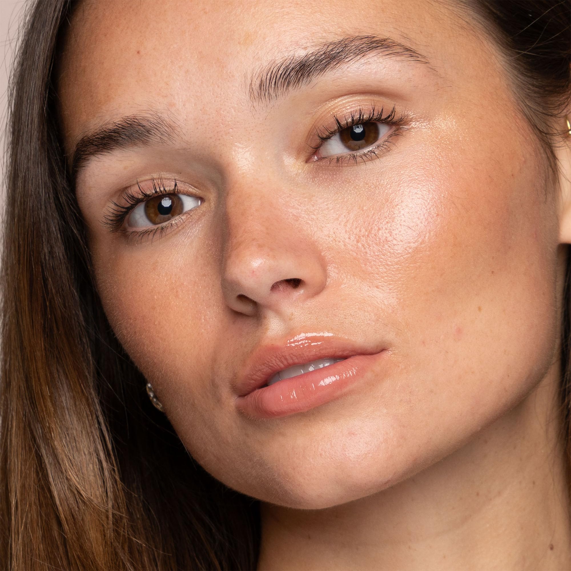 Close-up of Jouer Powder Highlighter Rose Quartz being applied for luminosity.