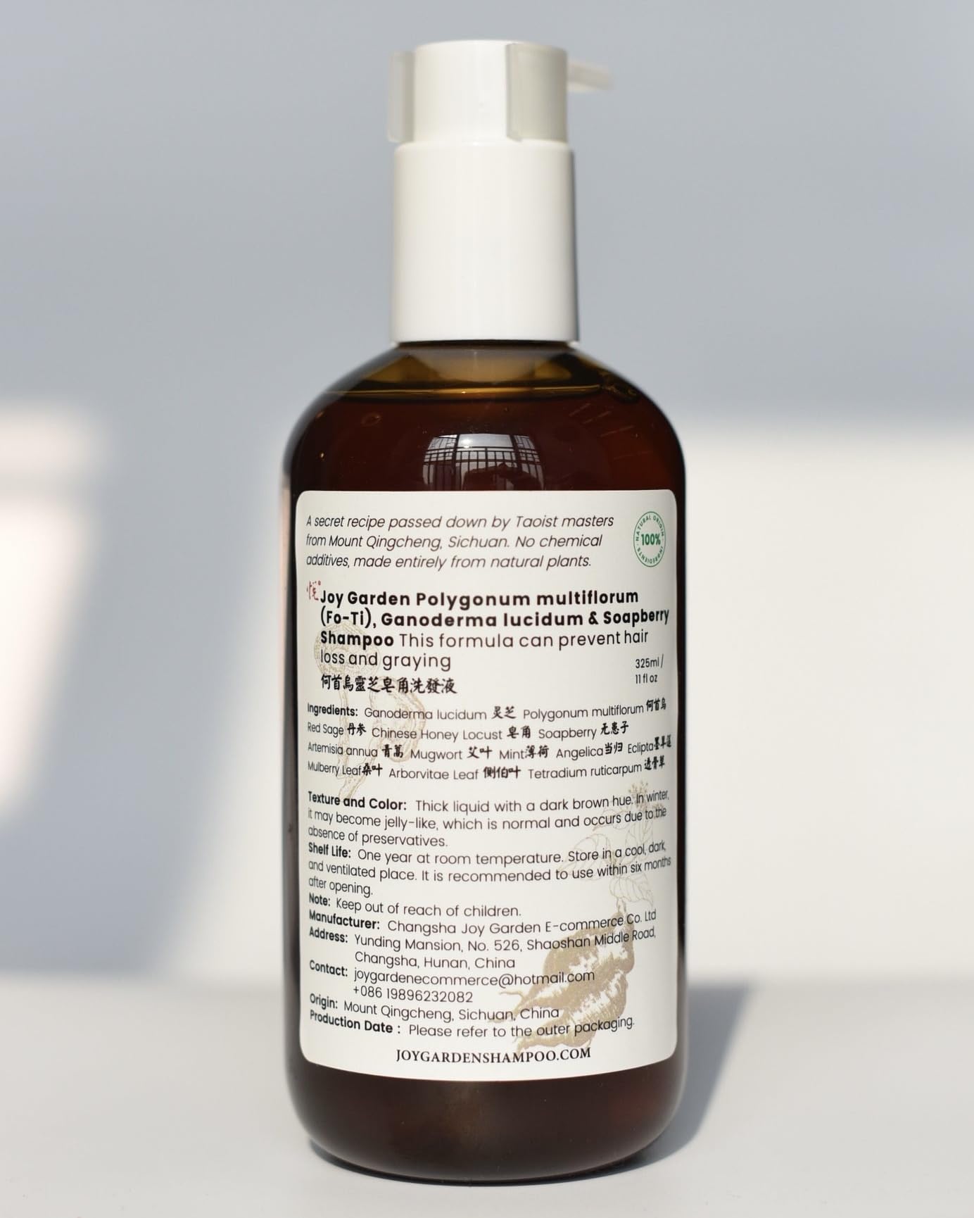 Joy Garden He Shou Wu shampoo bottle with herbal formula for daily cleansing.