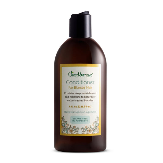Just Nutritive Blonde Conditioner bottle showing brassy-tone neutralization for vibrant blondes.