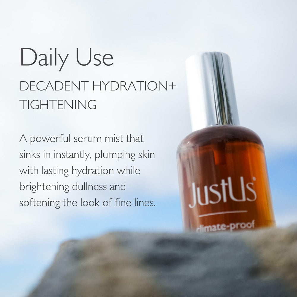 Just Us Tighten + Glow Serum Mist spray in action for a refreshing hydration boost.