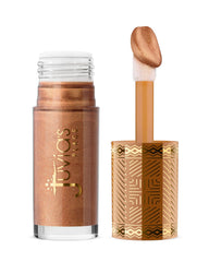 Juvia's Place Nubian Glow bottle shows buildable bronze shimmer for on-the-go glow.