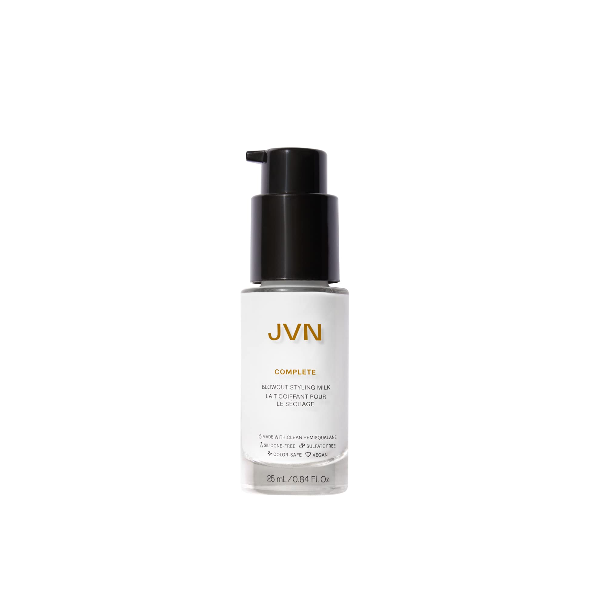 JVN Complete Blowout Styling Milk bottle pour showing easy application and heat protection preparation.