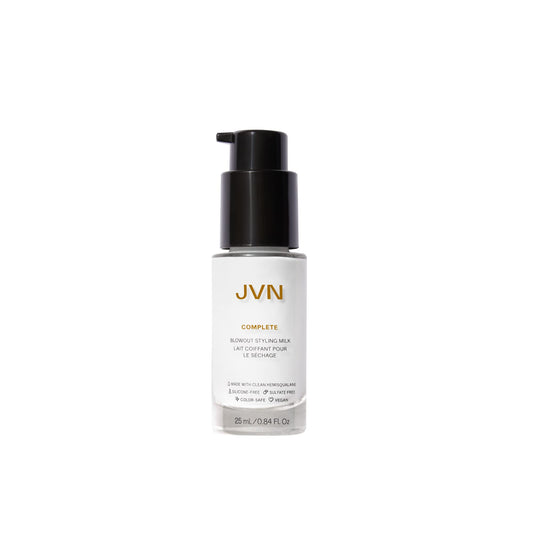 JVN Complete Blowout Styling Milk bottle pour showing easy application and heat protection preparation.