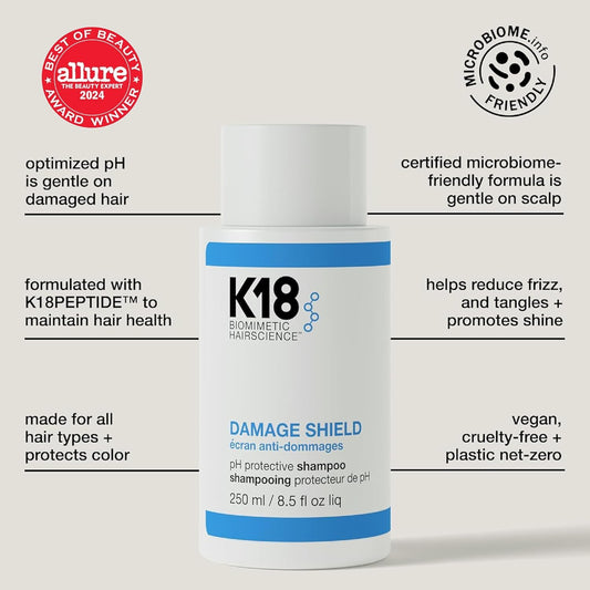 K18 Damage Shield Shampoo label close-up indicating premium care for smooth hair.