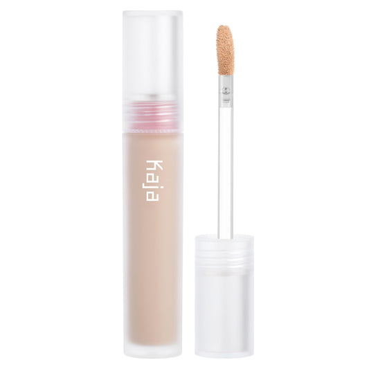 KAJA Don't Settle Concealer bottle application highlights hydration and lightweight coverage.