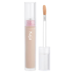 KAJA Don't Settle Concealer bottle application highlights hydration and lightweight coverage.
