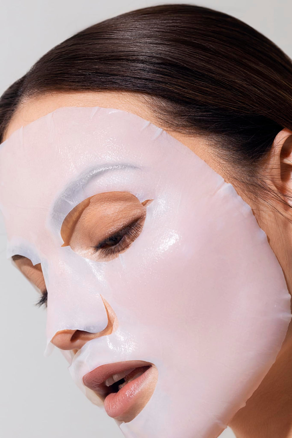 Karuna Face mask application gesture shows easy, at-home pampering.