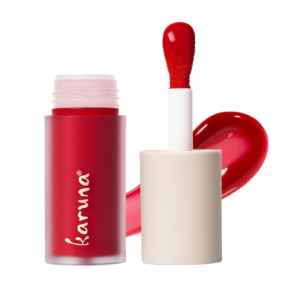 Karuna Skin Tinted Lip Oil bottle close-up showing a smooth, hydrating finish.