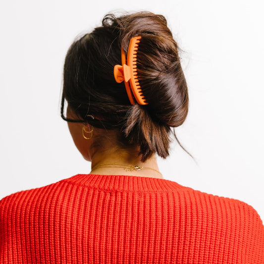 KAXI Hold Everything Midi hair claw neon orange front view for all hair types.
