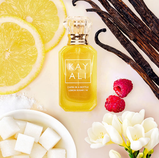 KAYALI Capri in a Bottle Lemon Sugar cap close-up showcases premium packaging.