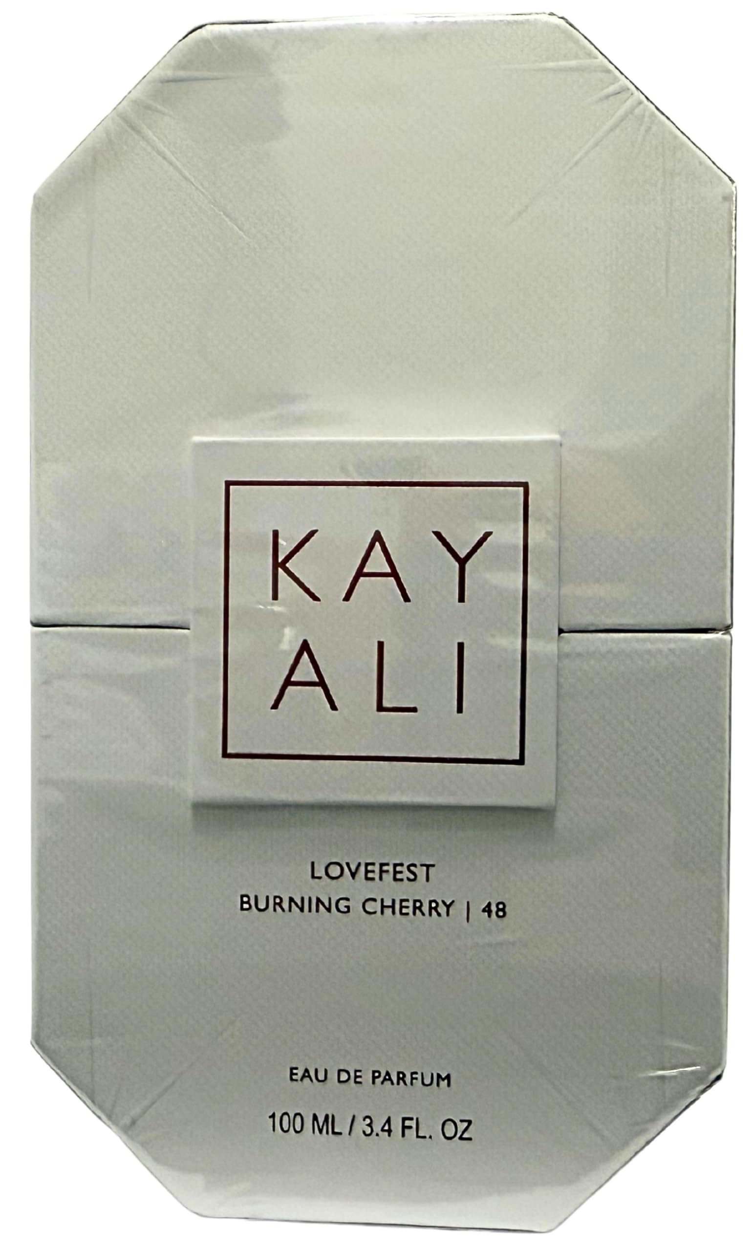 Kayali Lovefest Burning Cherry 48 bottle showing palo santo and guaiac wood base for warm depth.