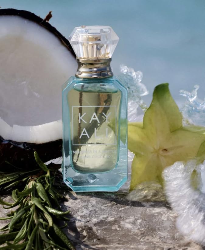 KAYALI Maldives in a Bottle Ylang Coco bottle closeup, highlighting tropical notes for travel-daily wear.