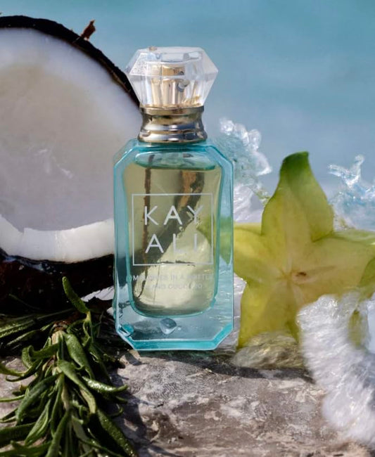 KAYALI Maldives in a Bottle Ylang Coco bottle closeup, highlighting tropical notes for travel-daily wear.
