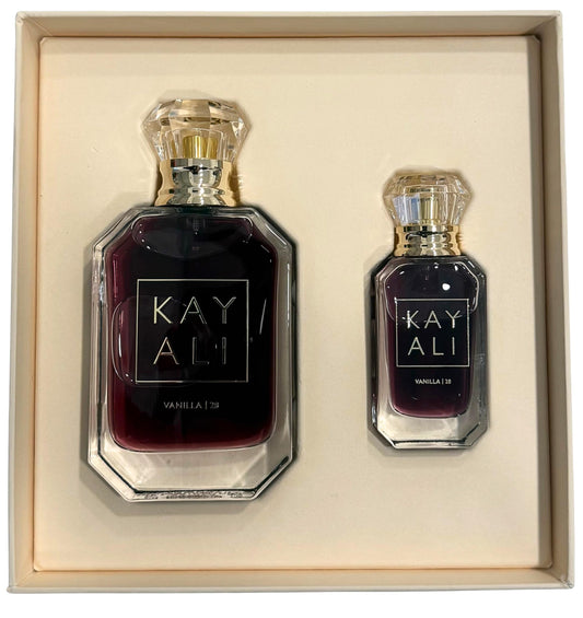 KAYALI Vanilla 28 bottle pour close-up showing warm vanilla sweetness for moments.