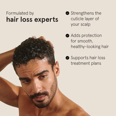 Keeps Thickening Conditioner ingredients close-up with biotin and caffeine benefits.