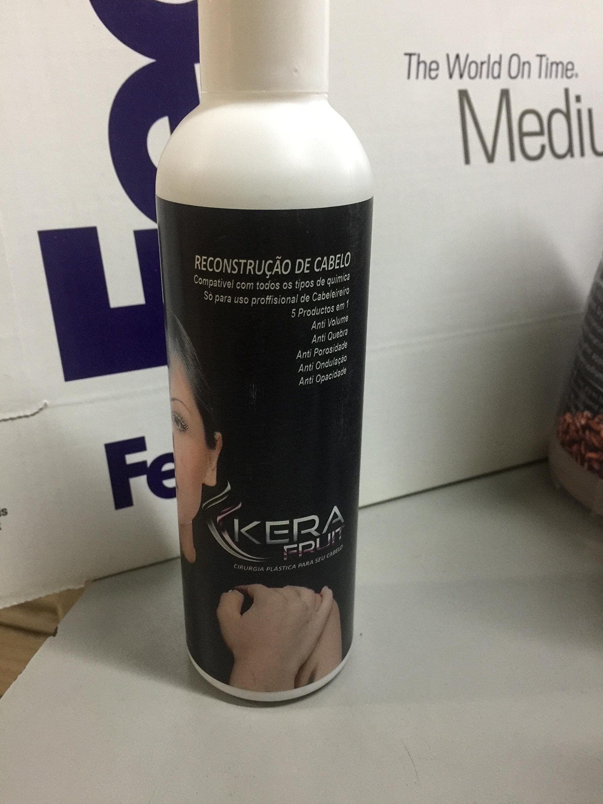 KERA FRUIT keratin kit applying treatment on hair.