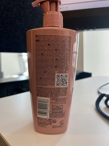 Kérastase Chroma Absolute bottle on bathroom counter for daily care.